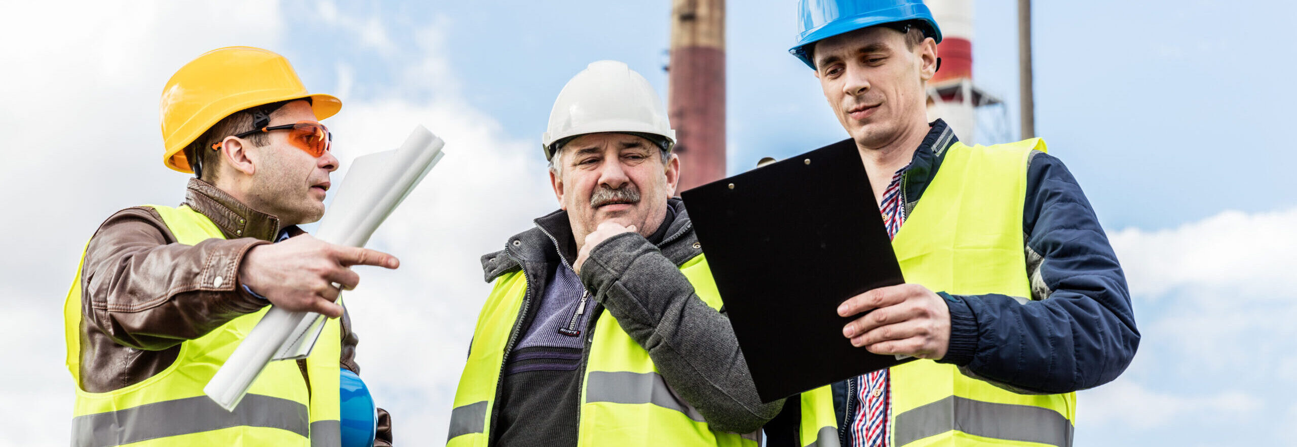 Construction engineers examining thermoelectric power station.